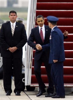 President Barack Obama and White House staffers return to the USA on Air Force One after four days in Mexico and the Caribbean.