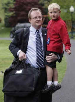 White House Press Secretary Robert Gibbs was met by his son and several family members on the South Lawn of the White House.