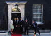 President Barack Obama and First Lady Michelle Obama are greeted by UK PM Gordon Brown and his wife Sarah at 10 Downing Street.