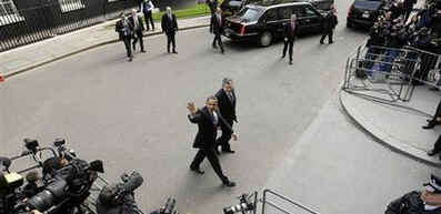 President Barack Obama and PM Gordon Brown leave 10 Downing Street after joint meeting and walk to the Foreign and Commonwealth Office building to hold a joint news conference.