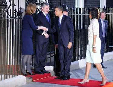 President Barack Obama and First Lady Michelle Obama are greeted by UK PM Gordon Brown and his wife Sarah at 10 Downing Street.