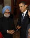 The US President meets Indian PM Singh during the Buckingham Palace reception.