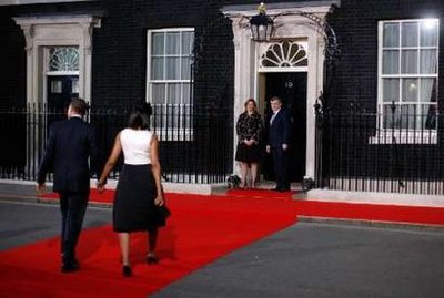 President Barack Obama and First Lady Michelle Obama arrive at 10 Downing Street where their day started earlier.