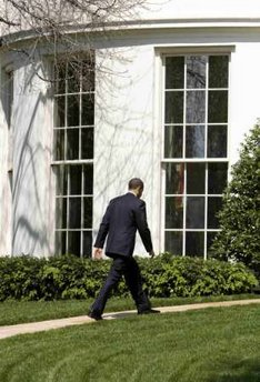 President Barack Obama returns to the Oval Office in the White House.