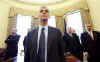 Rahm Emanuel listens to Obama in the Oval Office.