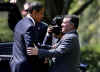 President Barack Obama walks King Abdullah II of Jordan to his limousine after meetings in the White House.