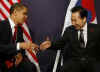 President Barack Obama meets with South Korean President Lee Myung-bak at the Excel Centre in London.