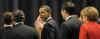 President Obama escorted German chancellor Angela Merkel from the stage after making gestures during the first G20 group photo.