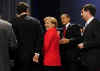 President Obama escorted German chancellor Angela Merkel from the stage after making gestures during the first G20 group photo.