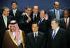 President Obama gestures during the group photo with Russian President Medvedev and Italian Prime Minister Berlusconi.