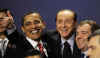 President Obama gestures during the group photo with Russian President Medvedev and Italian Prime Minister Berlusconi.