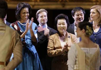 First Lady Michelle Obama joins Sarah Brown, the wife of UK PM Brown, and other spouses of G20 leaders at a special performance of Giselle at the Royal Opera House in London on April 2, 2009.