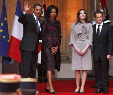 US President Barack Obama and First Lady Michelle Obama pose with French President Sarkozy and French First Lady Carla Bruni-Sarkozy on the steps of the Palais Rohan.