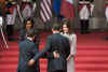 US President Barack Obama and First Lady Michelle Obama pose with French President Sarkozy and French First Lady Carla Bruni-Sarkozy on the steps of the Palais Rohan.