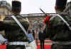 A French military band played the French and American national anthems at the ceremony in the Palais Rohan.