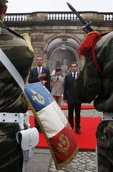 A French military band played the French and American national anthems at the ceremony in the Palais Rohan.