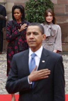 A French military band played the French and American national anthems at the ceremony in the Palais Rohan. First Lady Michelle Obama and French First Lady Carla Bruni-Sarkozy participated in the Strasbourg, France arrival ceremony.