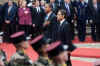 A French military band played the French and American national anthems at the ceremony in the Palais Rohan.