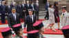 President Barack Obama walks by a military honor guard in the palace courtyard and partakes in a welcoming ceremony.