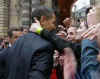 President Obama and First Lady Michelle Obama were greeted by a crowd of French supporters.