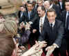 President Barack Obama and First Lady Michelle Obama say goodbye to the waiting crowds and President Sarkozy.