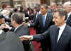 President Barack Obama and First Lady Michelle Obama say goodbye to the waiting crowds and President Sarkozy.