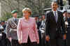 President Barack Obama joins German Chancellor Angela Merkel to inspect a German Military Honour Guard.