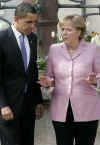 US President Barack Obama and German Chancellor Angela Merkel talk as they stroll through the market on their way to a welcoming ceremony in Baden-Baden Germany on April 3, 2009.