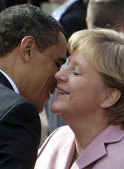 President Barack Obama and First Lady Michelle Obama are cheered by the crowd, and welcomed by German Chancellor Angela Merkel and her husband Joachim Sauer in the market at Baden-Baden, Germany on April 3, 2009.