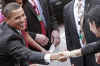 President Barack Obama and First Lady Michelle Obama are cheered by the crowd, and welcomed by German Chancellor Angela Merkel and her husband Joachim Sauer in the market at Baden-Baden, Germany on April 3, 2009.