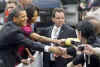 President Barack Obama and First Lady Michelle Obama are cheered by the crowd, and welcomed by German Chancellor Angela Merkel and her husband Joachim Sauer in the market at Baden-Baden, Germany on April 3, 2009.