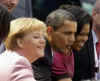 President Barack Obama and First Lady Michelle Obama are cheered by the crowd, and welcomed by German Chancellor Angela Merkel and her husband Joachim Sauer in the market at Baden-Baden, Germany on April 3, 2009.