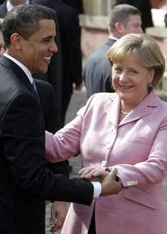 President Barack Obama and First Lady Michelle Obama are cheered by the crowd, and welcomed by German Chancellor Angela Merkel and her husband Joachim Sauer in the market at Baden-Baden, Germany on April 3, 2009.