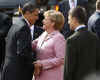 President Barack Obama and First Lady Michelle Obama are cheered by the crowd, and welcomed by German Chancellor Angela Merkel and her husband Joachim Sauer in the market at Baden-Baden, Germany on April 3, 2009.