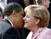 President Barack Obama and First Lady Michelle Obama are cheered by the crowd, and welcomed by German Chancellor Angela Merkel and her husband Joachim Sauer in the market at Baden-Baden, Germany on April 3, 2009.