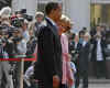 President Barack Obama and German Chancellor Angela Merkel pause for the national anthems of the US and Germany.