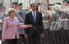 President Barack Obama joins German Chancellor Angela Merkel to inspect a German Military Honour Guard.