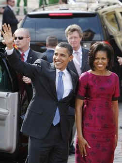 President Barack Obama and First Lady Michelle Obama are cheered by the crowd, and welcomed by German Chancellor Angela Merkel and her husband Joachim Sauer in the market at Baden-Baden, Germany on April 3, 2009.