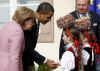 President Obama is greeted by Baden-Baden Mayor Wolfgang Gerstner, and young Germans dressed in traditional Black Forest area dress.