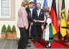 President Obama is greeted by Baden-Baden Mayor Wolfgang Gerstner, and young Germans dressed in traditional Black Forest area dress.