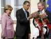 President Obama is greeted by Baden-Baden Mayor Wolfgang Gerstner, and young Germans dressed in traditional Black Forest area dress.