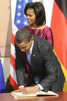 President Obama and First Lady Michelle Obama sign the Baden-Baden Golden Book at the Rathaus (City Hall).