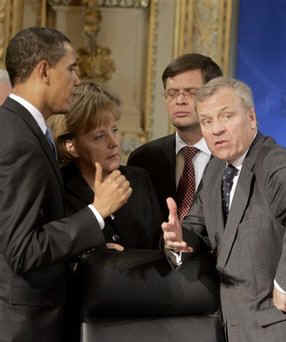 President Obama, NATO Secretary General de Hoop Scheffer (photo), and NATO leaders assemble in a meeting room in the Kurhaus in Baden-Baden.