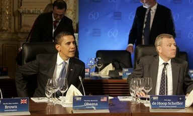 President Obama, NATO Secretary General de Hoop Scheffer (photo), and NATO leaders assemble in a meeting room in the Kurhaus in Baden-Baden.