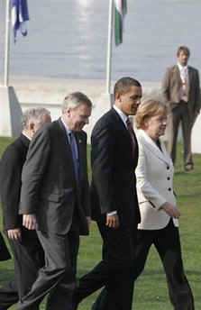 President Barack Obama and the NATO leaders walk in a ceremonial crossing of the Passarelle Mimram (Two Banks) Pedestrian Bridge from Kehl, Germany to Strasbourg, France on April 4, 2009.