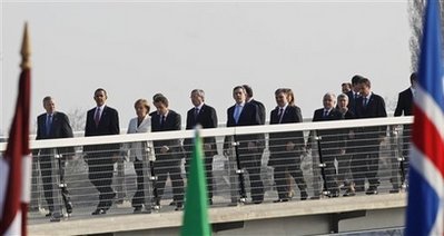 President Barack Obama and the NATO leaders walk in a ceremonial crossing of the Passarelle Mimram (Two Banks) Pedestrian Bridge from Kehl, Germany to Strasbourg, France on April 4, 2009.