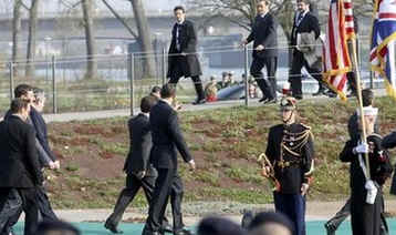 President Barack Obama and the NATO leaders walk in a ceremonial crossing of the Passarelle Mimram (Two Banks) Pedestrian Bridge from Kehl, Germany to Strasbourg, France on April 4, 2009.