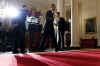 President Barack Obama, US Treasury Secretary Timothy Geithner, and Internal Revenue Service (IRS) Commissioner Doug Shulman remark on tax reform in the Grand Foyer of the White House on May 4, 2009.