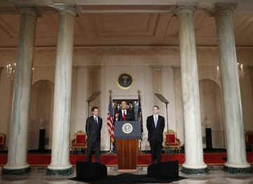 President Barack Obama, US Treasury Secretary Timothy Geithner, and Internal Revenue Service (IRS) Commissioner Doug Shulman remark on tax reform in the Grand Foyer of the White House on May 4, 2009.