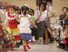 First Lady Michelle Obama celebrates Cinco de Mayo, an Hispanic heritage event, in a celebration with students at Lamb Public Charter School in Washington on May 4, 2009.